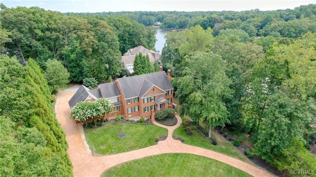 aerial view featuring a water view and a forest view