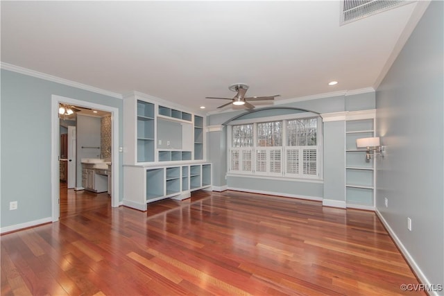 unfurnished living room with crown molding, ceiling fan, baseboards, and wood finished floors