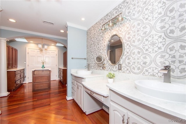 full bathroom featuring recessed lighting, visible vents, ornamental molding, wood finished floors, and ornate columns