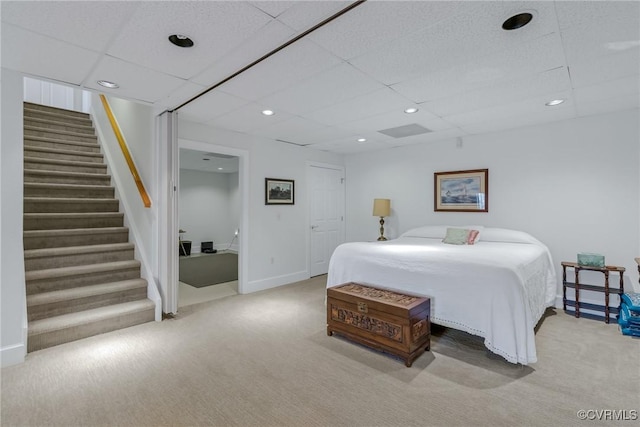 carpeted bedroom featuring a paneled ceiling