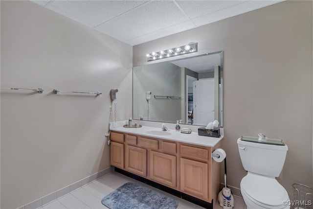 bathroom featuring tile patterned floors, vanity, and toilet