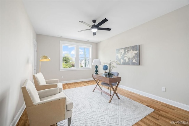 office area with ceiling fan and light hardwood / wood-style flooring