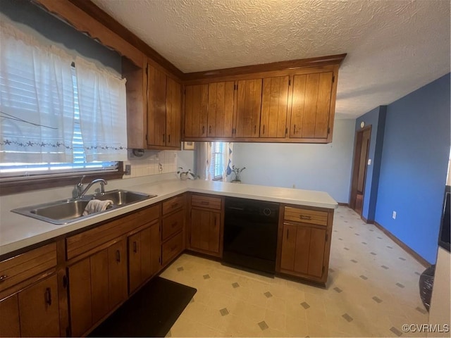 kitchen with dishwasher, a textured ceiling, kitchen peninsula, and sink