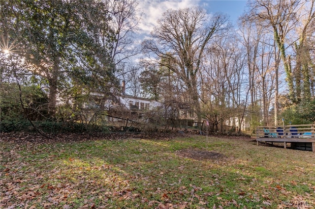 view of yard with a wooden deck