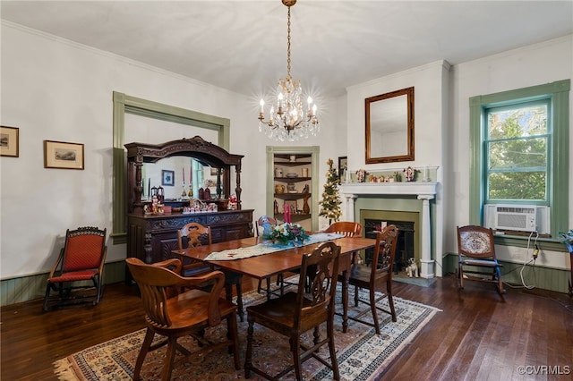 dining area with crown molding, dark hardwood / wood-style flooring, cooling unit, and an inviting chandelier