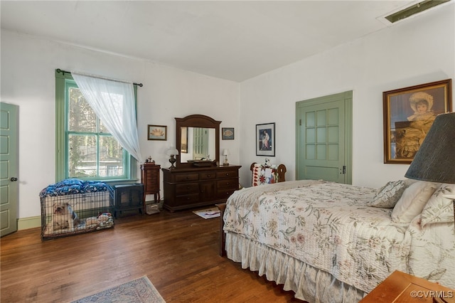 bedroom featuring dark hardwood / wood-style floors