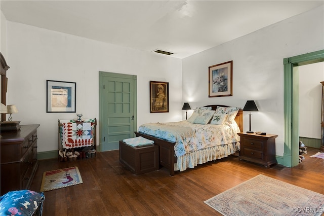 bedroom featuring dark wood-type flooring