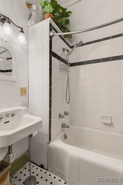 bathroom with tile patterned floors and tiled shower / bath combo