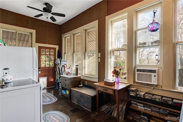 interior space featuring ceiling fan and cooling unit