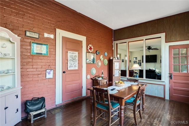 dining area with built in shelves, dark hardwood / wood-style floors, and ceiling fan