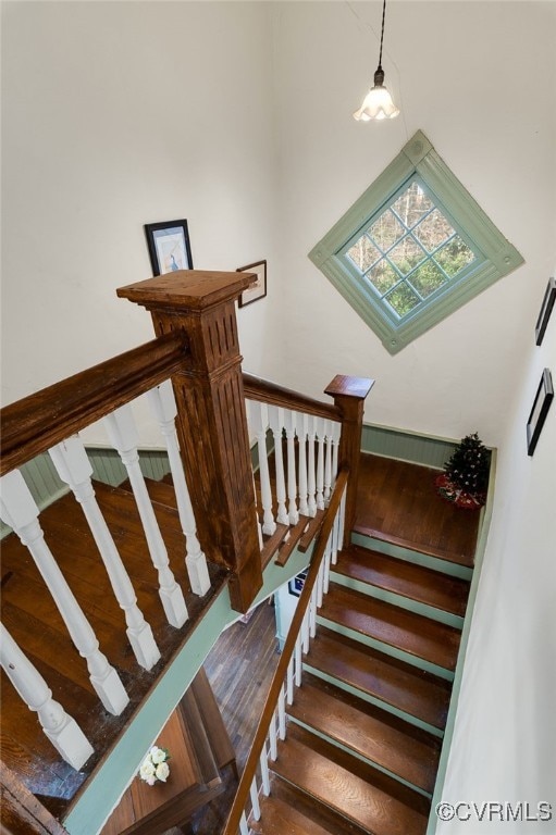 stairway featuring hardwood / wood-style floors