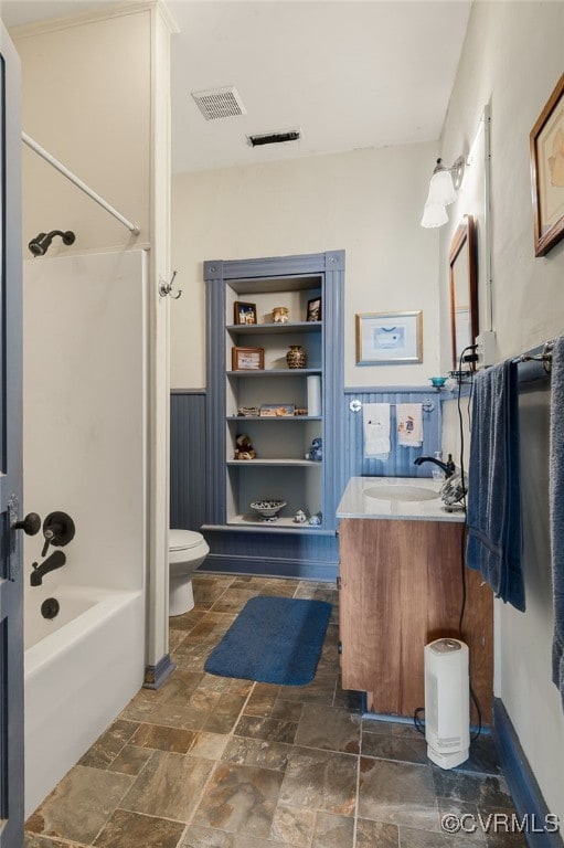 full bathroom with vanity, bathing tub / shower combination, and toilet