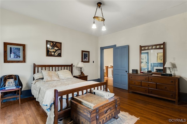 bedroom featuring dark wood-type flooring