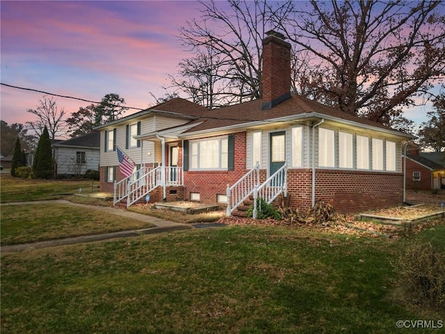 view of front of house with a lawn