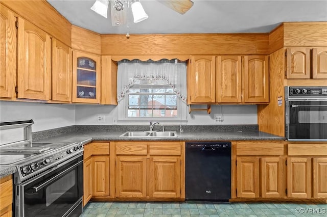 kitchen featuring ceiling fan, sink, and black appliances