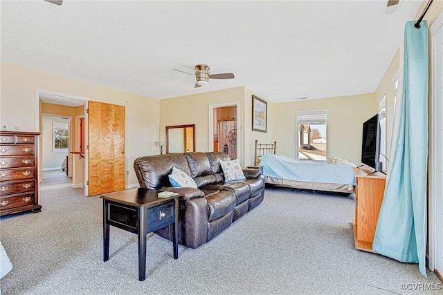 bedroom with light colored carpet and ceiling fan