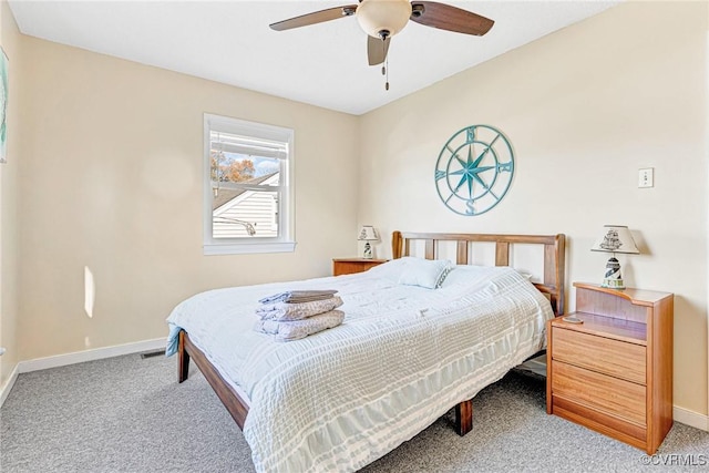 bedroom with ceiling fan and light carpet