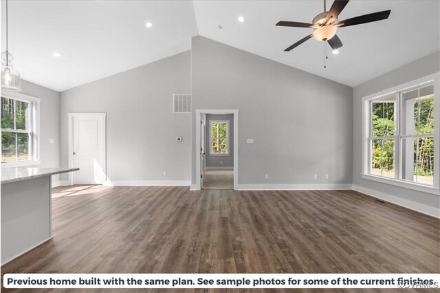 unfurnished living room featuring high vaulted ceiling, ceiling fan, and dark hardwood / wood-style floors