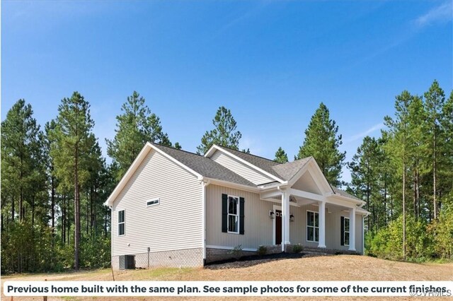 view of front of home with a porch and central air condition unit