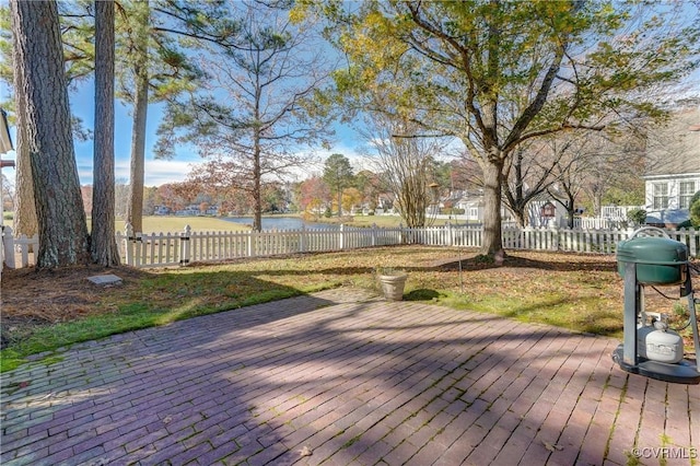 deck featuring area for grilling and a water view