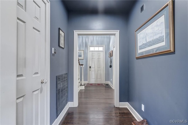 doorway with dark hardwood / wood-style flooring