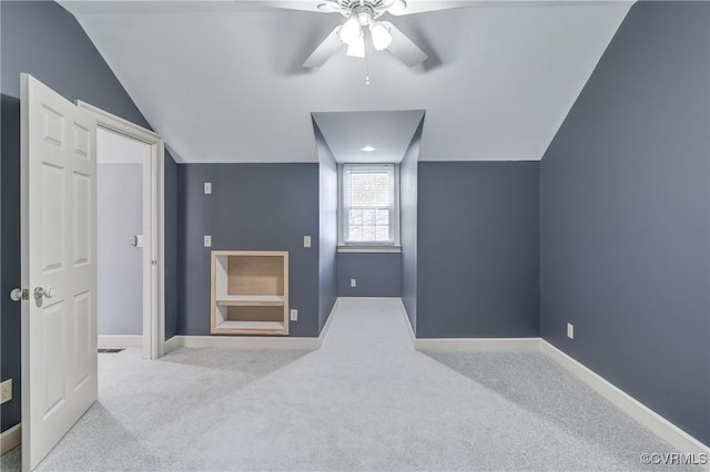 additional living space with light carpet, ceiling fan, and lofted ceiling