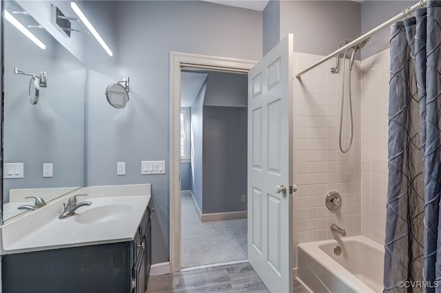 bathroom with shower / bath combination with curtain, vanity, and wood-type flooring