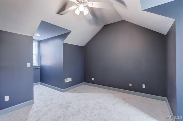 bonus room with ceiling fan, light colored carpet, and lofted ceiling