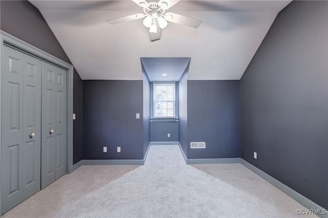 bonus room featuring light carpet, ceiling fan, and lofted ceiling