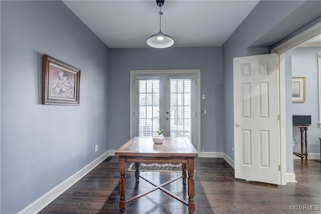 dining room featuring french doors and dark hardwood / wood-style flooring