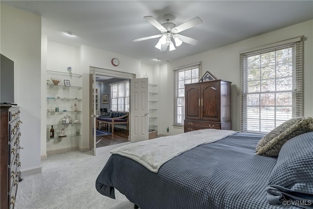 carpeted bedroom featuring ceiling fan