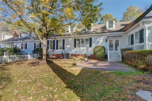 back of house featuring a yard