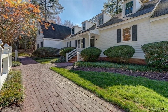 view of home's exterior with a lawn