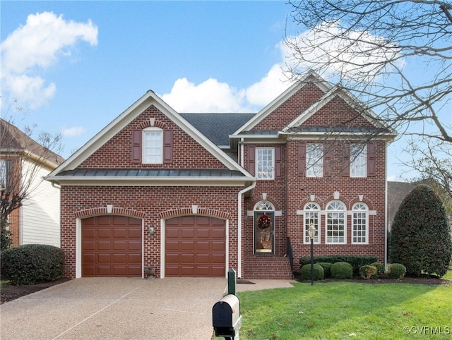 view of front of home with a garage and a front lawn