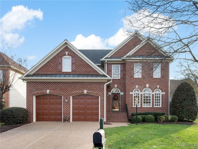 view of front of house with an attached garage, a front lawn, concrete driveway, and brick siding