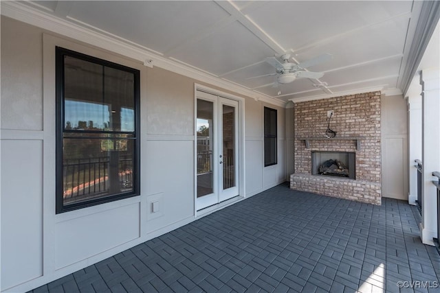 view of patio / terrace featuring french doors, an outdoor brick fireplace, and ceiling fan