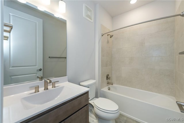 full bathroom with vanity, tiled shower / bath combo, and toilet