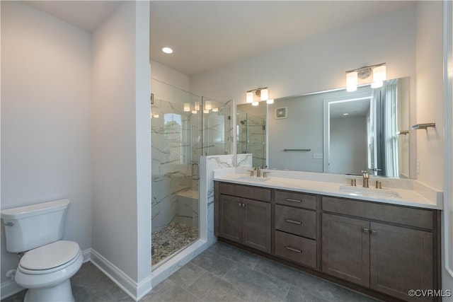 bathroom with tile patterned floors, vanity, toilet, and an enclosed shower