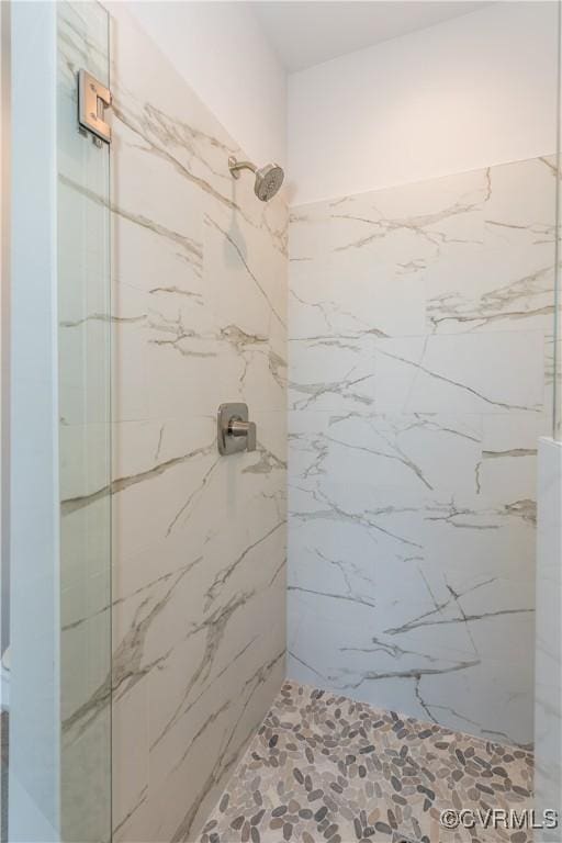 bathroom with a tile shower