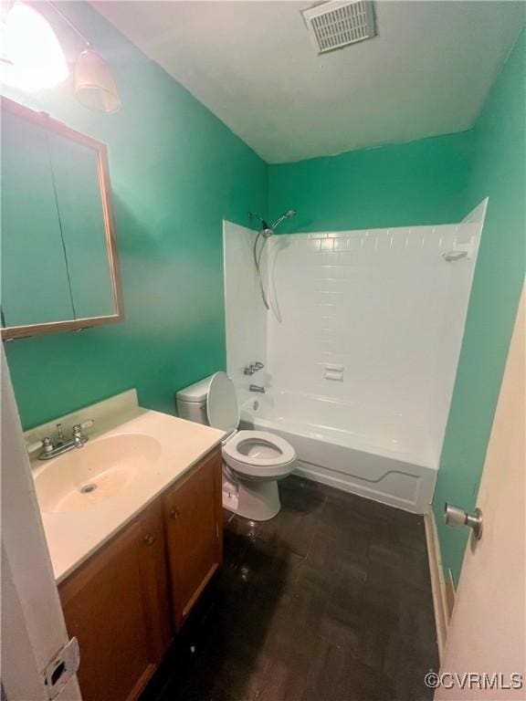 full bathroom featuring bathing tub / shower combination, vanity, wood-type flooring, and toilet