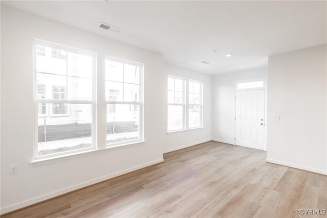 spare room featuring light hardwood / wood-style floors