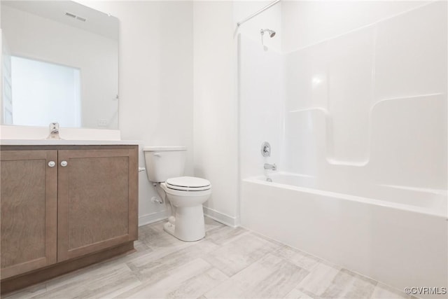 full bathroom with toilet, vanity, and tub / shower combination