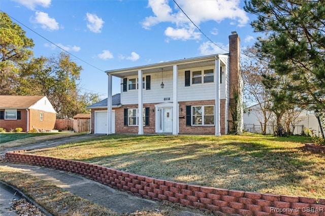 view of front of property featuring a porch, a garage, and a front lawn