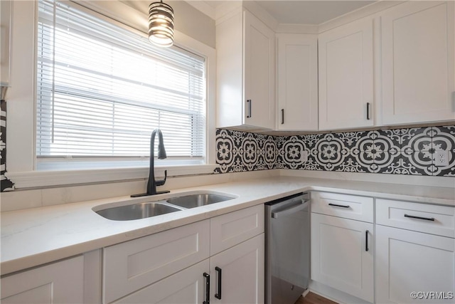 kitchen with stainless steel dishwasher and white cabinets