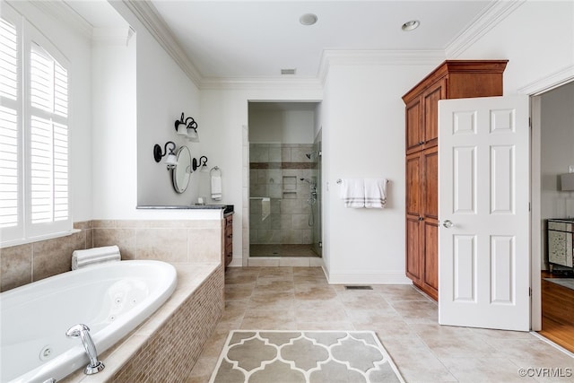 bathroom with tile patterned floors, independent shower and bath, and ornamental molding