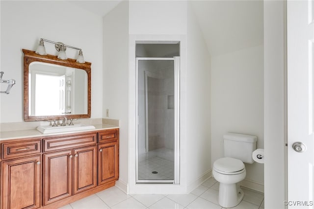 bathroom featuring tile patterned floors, vanity, toilet, and an enclosed shower