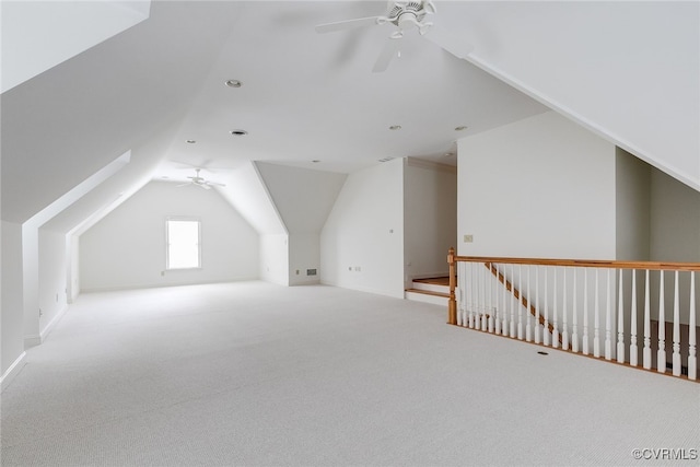 bonus room featuring ceiling fan, carpet floors, and vaulted ceiling