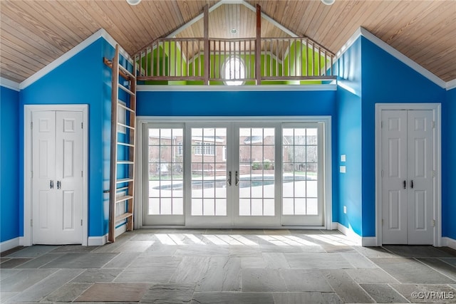 foyer featuring high vaulted ceiling, plenty of natural light, and wood ceiling