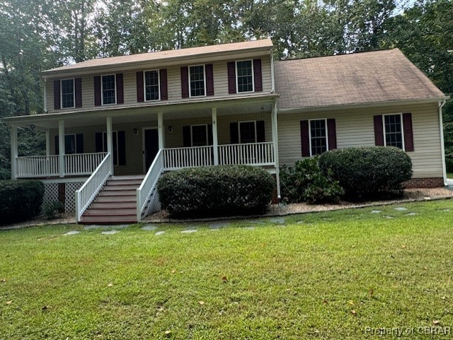 view of front of home featuring covered porch and a front yard