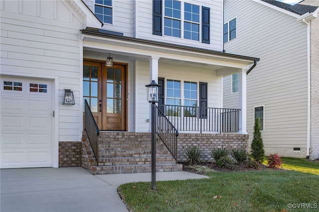 doorway to property featuring french doors and covered porch